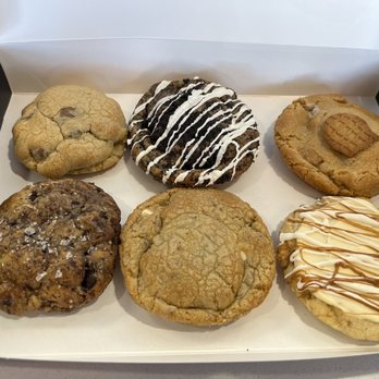Crave Cookies - From top left: Chocolate Chip, Oreo Cheesecake, Nutter Butter, Salted Caramel, Baked Butterbeer, Cookie Butter Cheesecake - Desserts Near Me - South Ogden, Utah