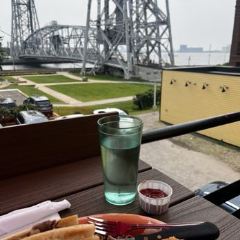 Grandma’s Saloon & Grill - Canal Park - Pulled pork hoagie sandwich with onion rings and a nice view - American Near Me - Duluth, Minnesota