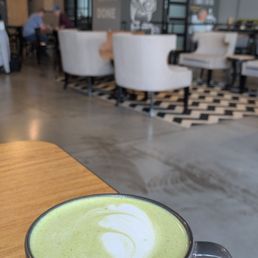 Matcha latte with my favorite view of this encouraging wall in the cafe Matcha latte with my favorite view of this encouraging wall in the cafe