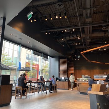 Starbucks - people sitting at tables in a coffee shop - Coffee & Tea Near Me - Toronto, Ontario