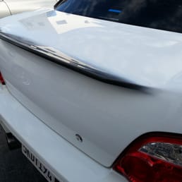 Carbon Fiber trunk paint matched to Subaru Aspen White with lip left raw.