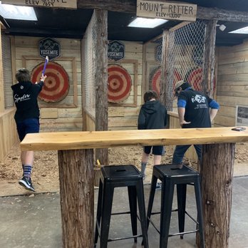 Yosemite Axe Throwing - Mammoth Lakes - Justin helping with stance and technique! - Axe Throwing Near Me - Mammoth Lakes, California