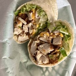 Classic chicken tender wrap with shredded cheese.