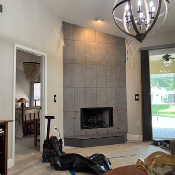R & A Coastal Designs - a living room with a fireplace - Handyman Near Me R & A Coastal Designs - a living room with a fireplace - Handyman Near Me
