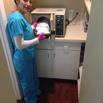 Time For Smiles Dental Center - Dental Assistant preparing instruments - Dentists Near Me - West Haven, Connecticut Time For Smiles Dental Center - Dental Assistant preparing instruments - Dentists Near Me - West Haven, Connecticut