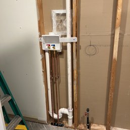 Before drywall, showing the gas line not extending out of the bay enough