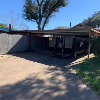 Waste Solutions USA - 30 yard. Home renovation before a rain. Not a problem. Expert driver fit container under carport for ease of dry loading in wet conditions. - Dumpster Rental Near Me - Hempstead, Texas Waste Solutions USA - 30 yard. Home renovation before a rain. Not a problem. Expert driver fit container under carport for ease of dry loading in wet conditions. - Dumpster Rental Near Me - Hempstead, Texas