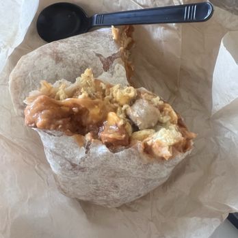 La Tapatia Mexican Grill - My breakfast burrito. I believe it has sausage, egg, beans, and cheese. - Mexican Near Me - Fontana, California La Tapatia Mexican Grill - My breakfast burrito. I believe it has sausage, egg, beans, and cheese. - Mexican Near Me - Fontana, California