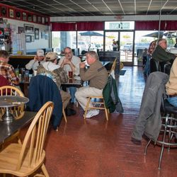 Yellow Submarine Pizza, Subs & Cheesesteaks - Dining room at Yellow Submarine in Nags Head full of happy customers.