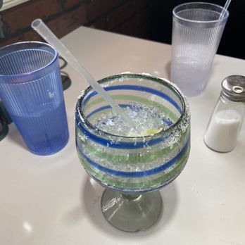 La Familia Tex-Mex - Large Margarita with dirty blue glass in background - Tex-Mex Near Me - Eureka Springs, Arkansas