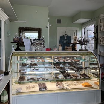 New Moon Magick - Enchanted Chocolates - a display case with a variety of chocolates - Candy Stores Near Me - Oak Bluffs, Massachusetts New Moon Magick - Enchanted Chocolates - a display case with a variety of chocolates - Candy Stores Near Me - Oak Bluffs, Massachusetts