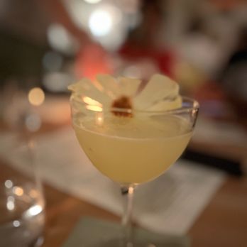 El Valle - a cocktail in a glass with a flower garnish - Mexican Near Me - Atlanta, Georgia