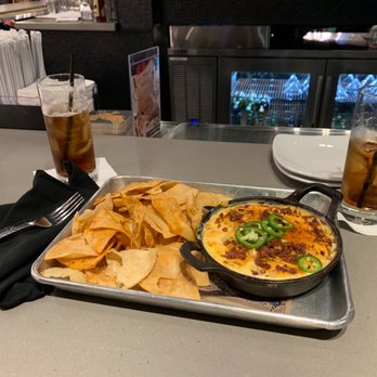 Guy Fieri's Branson Kitchen + Bar - Queso & Corn Dip.  Look at those chips!!! - Bars Near Me - Branson, Missouri