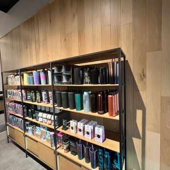 Starbucks - a shelf of coffee mugs and other items - Coffee & Tea Near Me - Winter Park, Florida