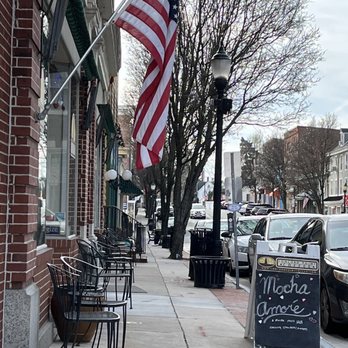 Concord Point Coffee - a sidewalk with tables and chairs and an american flag - Cafes Near Me - Havre de Grace, Maryland Concord Point Coffee - a sidewalk with tables and chairs and an american flag - Cafes Near Me - Havre de Grace, Maryland