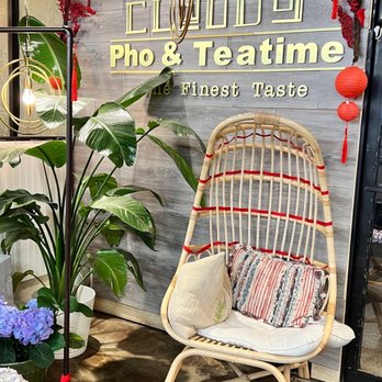 Cloud 9 - a rattan chair in front of a sign that says pho & tea time - Vietnamese Near Me - Vancouver, Washington