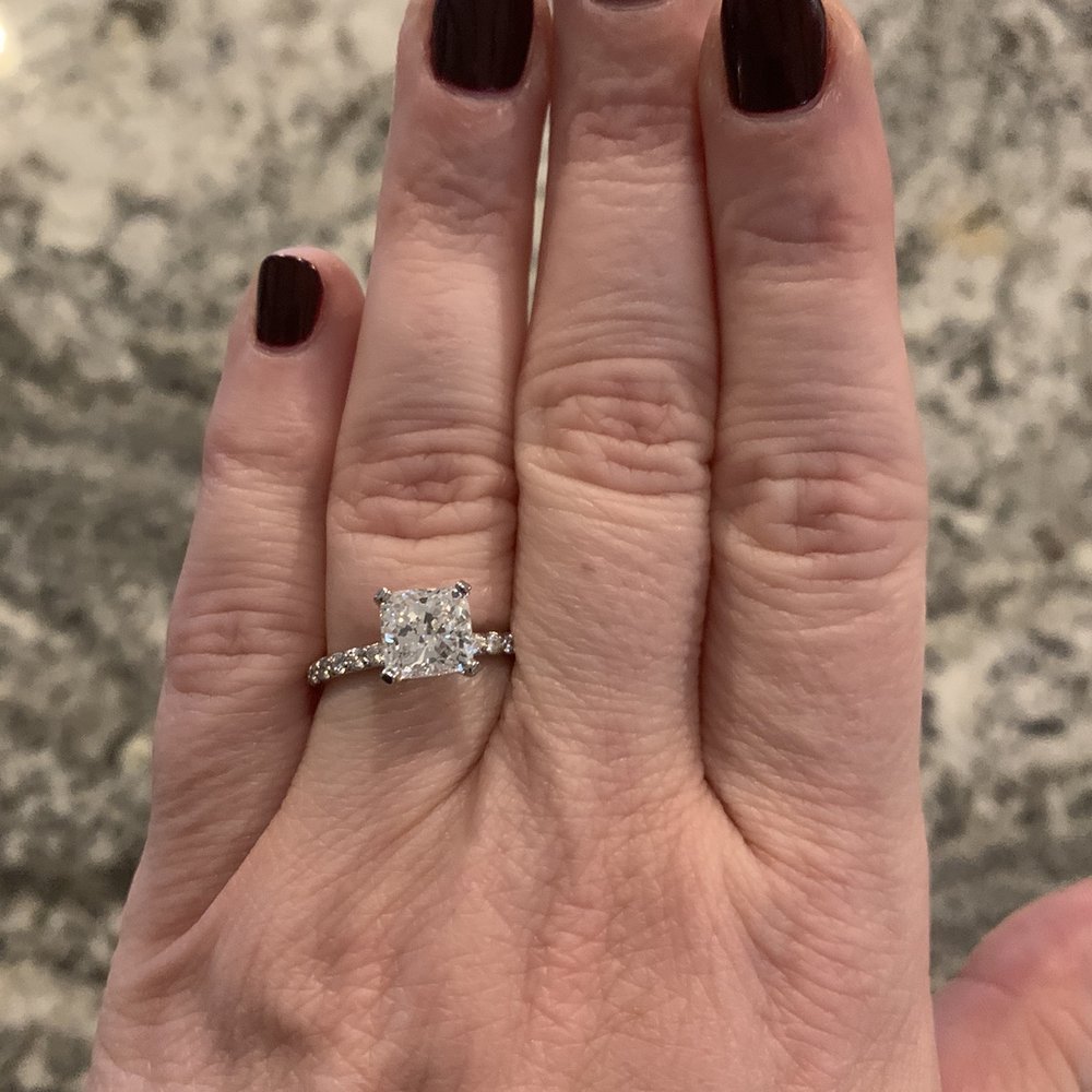 Cushion cut solitaire with pave diamond band. Cushion cut solitaire with pave diamond band.