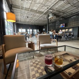 a checkerboard table and chairs