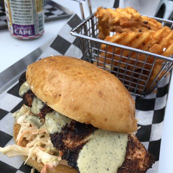 Exit Zero Filling Station - Blackened salmon sandwich with tangy slaw and waffle fries. - Burgers Near Me - Cape May, New Jersey Exit Zero Filling Station - Blackened salmon sandwich with tangy slaw and waffle fries. - Burgers Near Me - Cape May, New Jersey