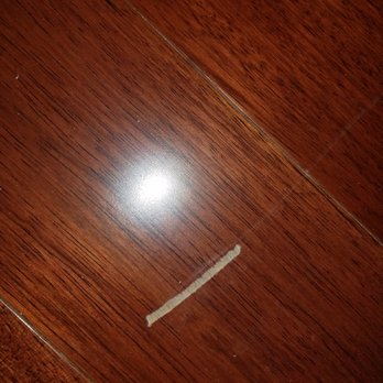 Kashian Bros - Multiple scraps in the floors, both living room and bedroom, hidden with furniture by employees - Carpeting Near Me - Wilmette, Illinois