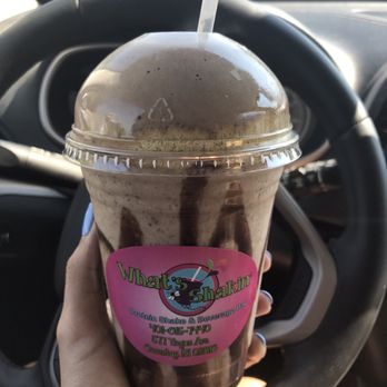 What's Shakin - a hand holding a cup of ice cream - Juice Bars & Smoothies Near Me - Coventry, Rhode Island