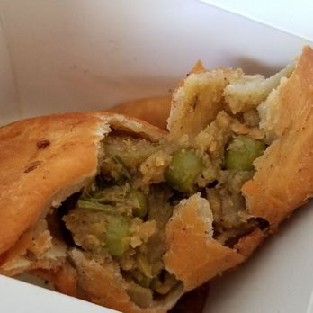 Raavi - Samosa: Two pieces, Deep fried pastry shells, stuffed with potatoes and peas ($4) - Indian Near Me - San Francisco, California