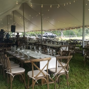 Barn Door Event Rentals - Large pole tent with dancefloor, stage, tables, chairs, linens, lighting, walls, and dinnerware - Party Equipment Rentals Near Me - Columbia Falls, Montana