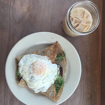 Bradbury's - Bacon, tomato, mixed greens savory crepe with a fried egg on top and an iced chai latte - Coffee & Tea Near Me - Madison, Wisconsin Bradbury's - Bacon, tomato, mixed greens savory crepe with a fried egg on top and an iced chai latte - Coffee & Tea Near Me - Madison, Wisconsin