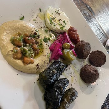 Marrakesh - Hummus, grapes leaves, goat cheese, and falafel with pita bread (not pictured) appetizer platter - Turkish Near Me - Jacksonville, North Carolina Marrakesh - Hummus, grapes leaves, goat cheese, and falafel with pita bread (not pictured) appetizer platter - Turkish Near Me - Jacksonville, North Carolina