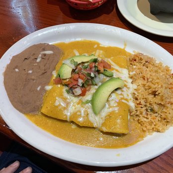 Jardin Corona - Chilada Suizas, bean and rice - Tex-Mex Near Me - Austin, Texas Jardin Corona - Chilada Suizas, bean and rice - Tex-Mex Near Me - Austin, Texas