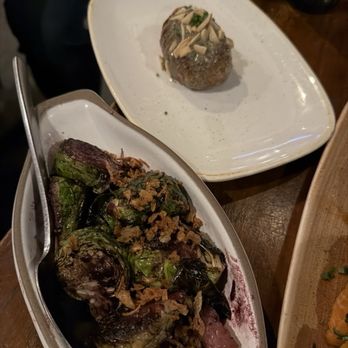 Charcoal Venice - Charcoal Venice - Dine LA 2026 - Hasselback Potato & Brussels Sprouts (smoked tallow-blueberry vinaigrette, bacon, crispy onions) - New American Near Me - Venice, California