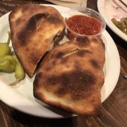 Piccolo's Pizza Admin Offices - MeatbLl calzone, salad , pepperoni pizza , onion rings of course. Everything cooked to perfection!