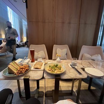 D Bar - a table with plates of food on it - Lounges Near Me - Toronto, Ontario