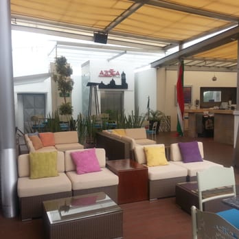 La Azotea Del Royalty - Colorful and covered seating area next to a DJ booth. - Mexican Near Me - Puebla, PUE