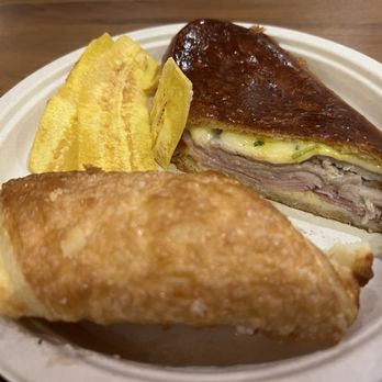 Porto's Bakery & Cafe - Mmmm that grilled medianoche roasted pork with melted cheese ,banana chips and a cheese roll - Bakeries Near Me - Downey, California Porto's Bakery & Cafe - Mmmm that grilled medianoche roasted pork with melted cheese ,banana chips and a cheese roll - Bakeries Near Me - Downey, California