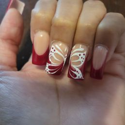 My birthday nails. Regular full set with white French tips and a design. This isn't what I requested but walked away with.