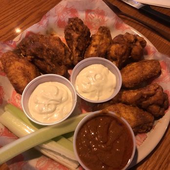 Tully's Good Times - Batavia - Tully's Original Wings with a side of hot sauce - Sports Bars Near Me - Batavia, New York Tully's Good Times - Batavia - Tully's Original Wings with a side of hot sauce - Sports Bars Near Me - Batavia, New York