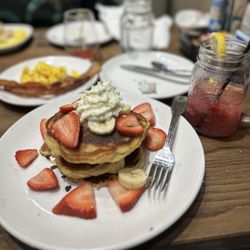 Another Broken Egg Cafe - Strawberry cream cheese pancakes with a side of Baked Bacon, scrambled eggs and Strawberry Lemonade Spritzer