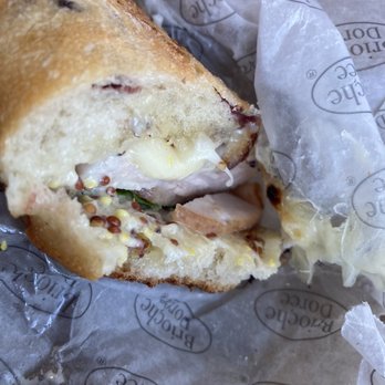 Brioche Dorée - a half eaten sandwich - Coffee & Tea Near Me - Charlotte, North Carolina