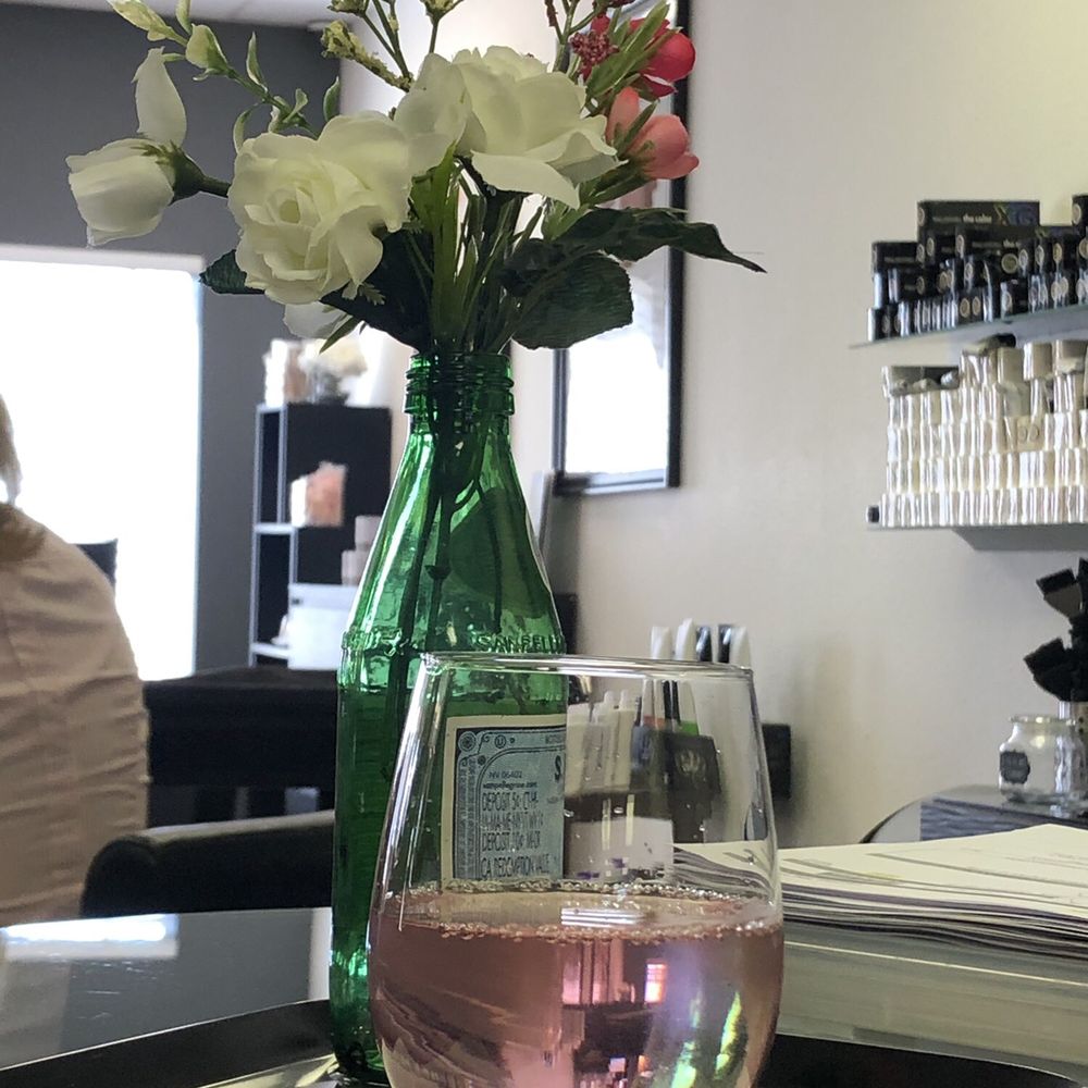 Lemon blueberry infused water served on a tray with a cute little flower arrangement Lemon blueberry infused water served on a tray with a cute little flower arrangement