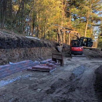 Cummings Contracting - a construction site with a bulldozer in the background - Masonry/Concrete Near Me - Indiana, Pennsylvania