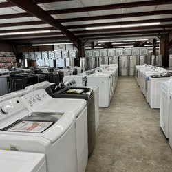 IHG Appliance - So many top load washers! More refrigerators in background!