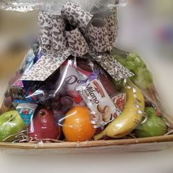 North End Florist - Something for everyone in this basket! Gourmet, snacks, fruit, chocolates! It's got it all!