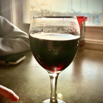 Waterman's Crab House - Generous wine pour in a dirty glass. - Seafood Near Me - Rock Hall, Maryland Waterman's Crab House - Generous wine pour in a dirty glass. - Seafood Near Me - Rock Hall, Maryland