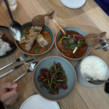 Nari - eggplant curry (top left), lamb shank curry (top right), chicken & green bean (bottom) - Thai Near Me - San Francisco, California Nari - eggplant curry (top left), lamb shank curry (top right), chicken & green bean (bottom) - Thai Near Me - San Francisco, California
