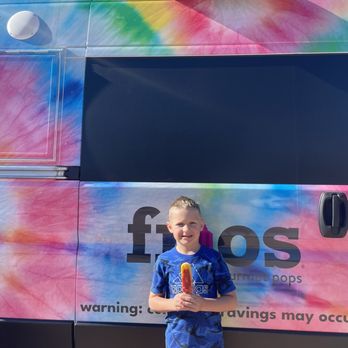 Frios Gourmet Pops - a young boy holding a pops - Ice Cream & Frozen Yogurt Near Me