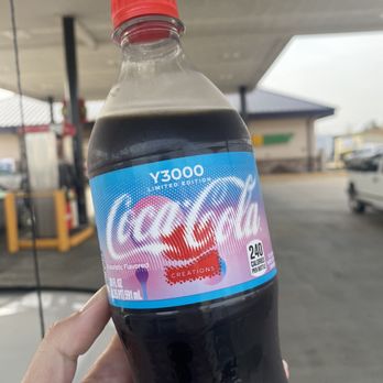 Pilot Travel Center - a hand holding a bottle of coca cola - Gas Stations Near Me - Denham Springs, Louisiana Pilot Travel Center - a hand holding a bottle of coca cola - Gas Stations Near Me - Denham Springs, Louisiana