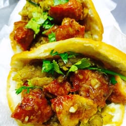 Wepa Arepa - Mofongo ( mashed fried plantain) fried pork bytes & fresh cilantro stuffed arepa