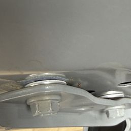 This is where they inserted washers and damaged the hinge This is where they inserted washers and damaged the hinge