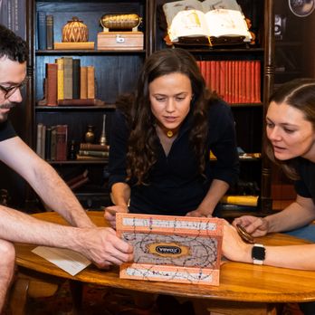 Handstand's Hunt - Players engaged in one of our portable escape rooms, Journey to Jidara! - Team Building Activities Near Me Handstand's Hunt - Players engaged in one of our portable escape rooms, Journey to Jidara! - Team Building Activities Near Me
